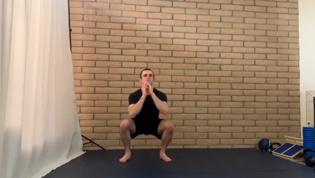 Bodyweight squat bottom position training for bjj workouts with jordan fernandez