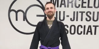 How Long to BJJ purple belt? Jordan Fernandez wearing his Jiu Jitsu purple belt and black BJJ Gi