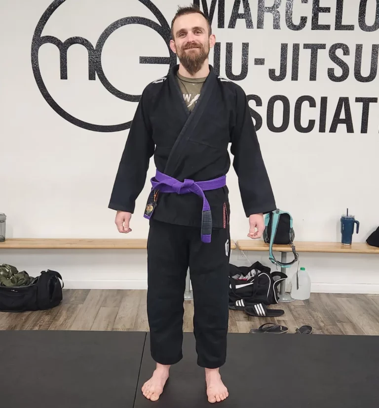 How Long to BJJ purple belt? Jordan Fernandez wearing his Jiu Jitsu purple belt and black BJJ Gi